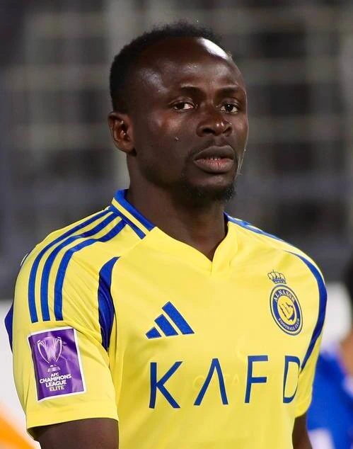 Sadio Mané in a yellow Al Nassr jersey during a match