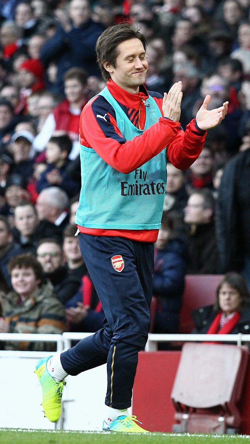 Tomáš Rosický clapping on the pitch in an Arsenal training or match setting