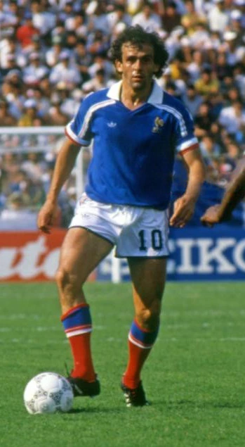 Michel Platini in action for France, wearing the blue national team kit